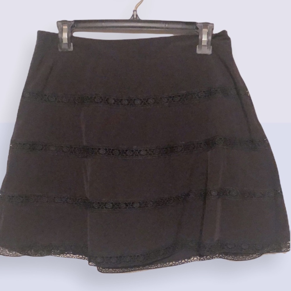 The limited black flare mini skirt with lace. Sz 6